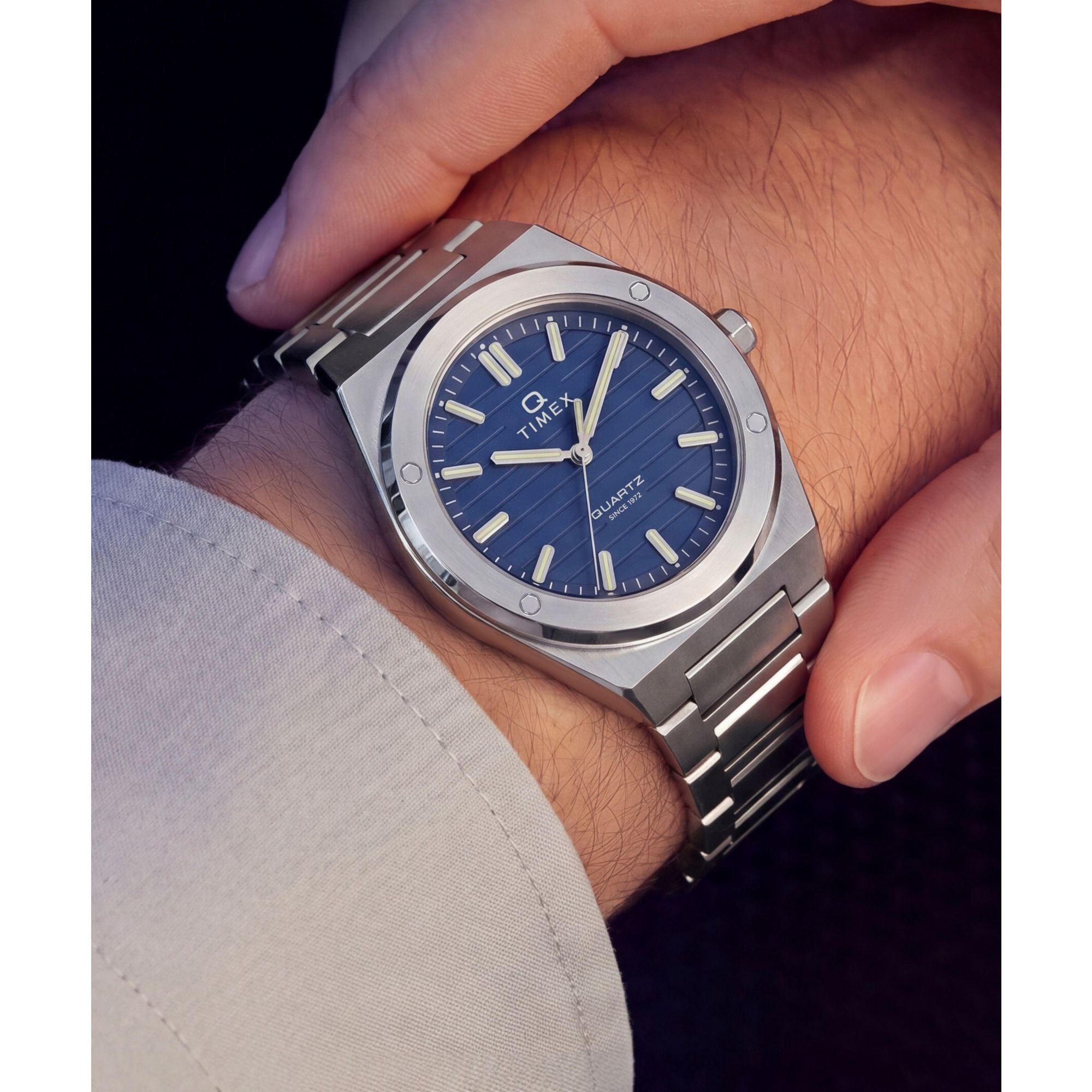 Timex Q Timex TW2Y81400 navy ribbed dial on a stainless steel bracelet, worn on the wrist