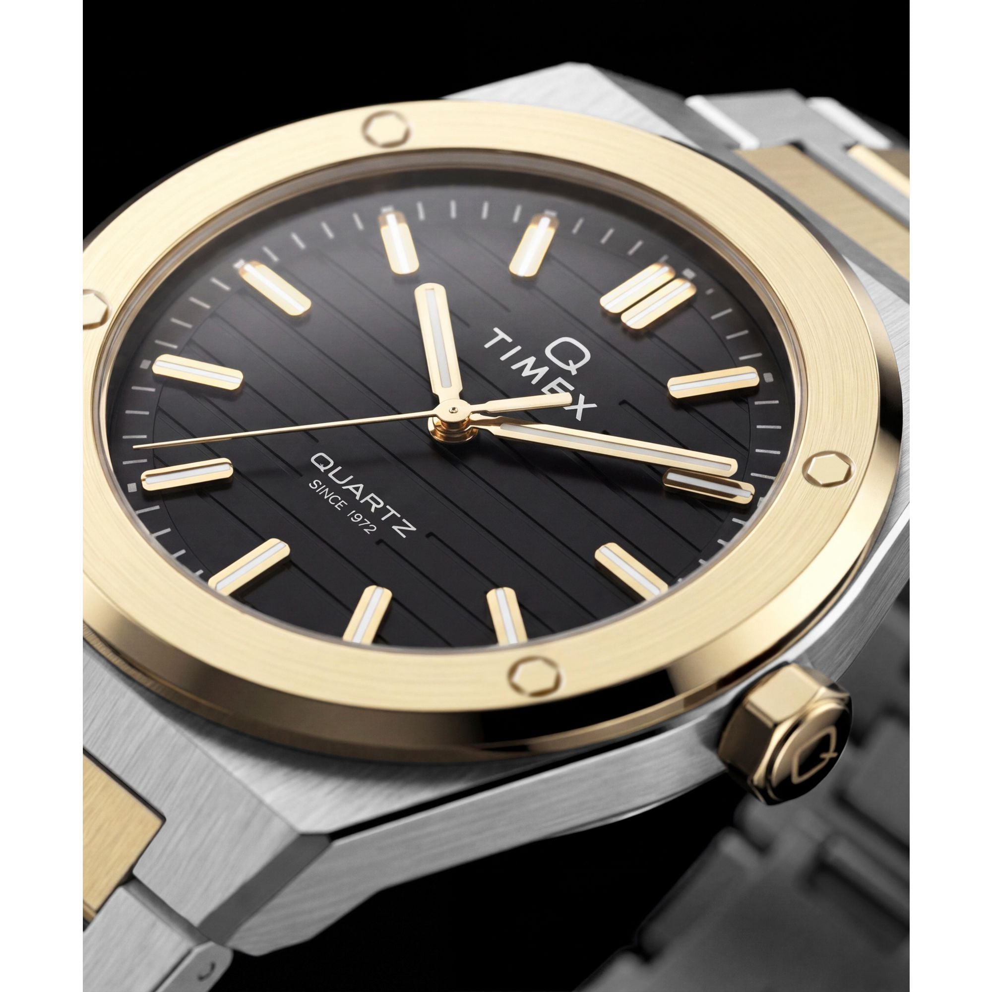 Timex Q Timex TW2Y81500 black ribbed dial with gold markers on a two-tone bracelet, dial close-up