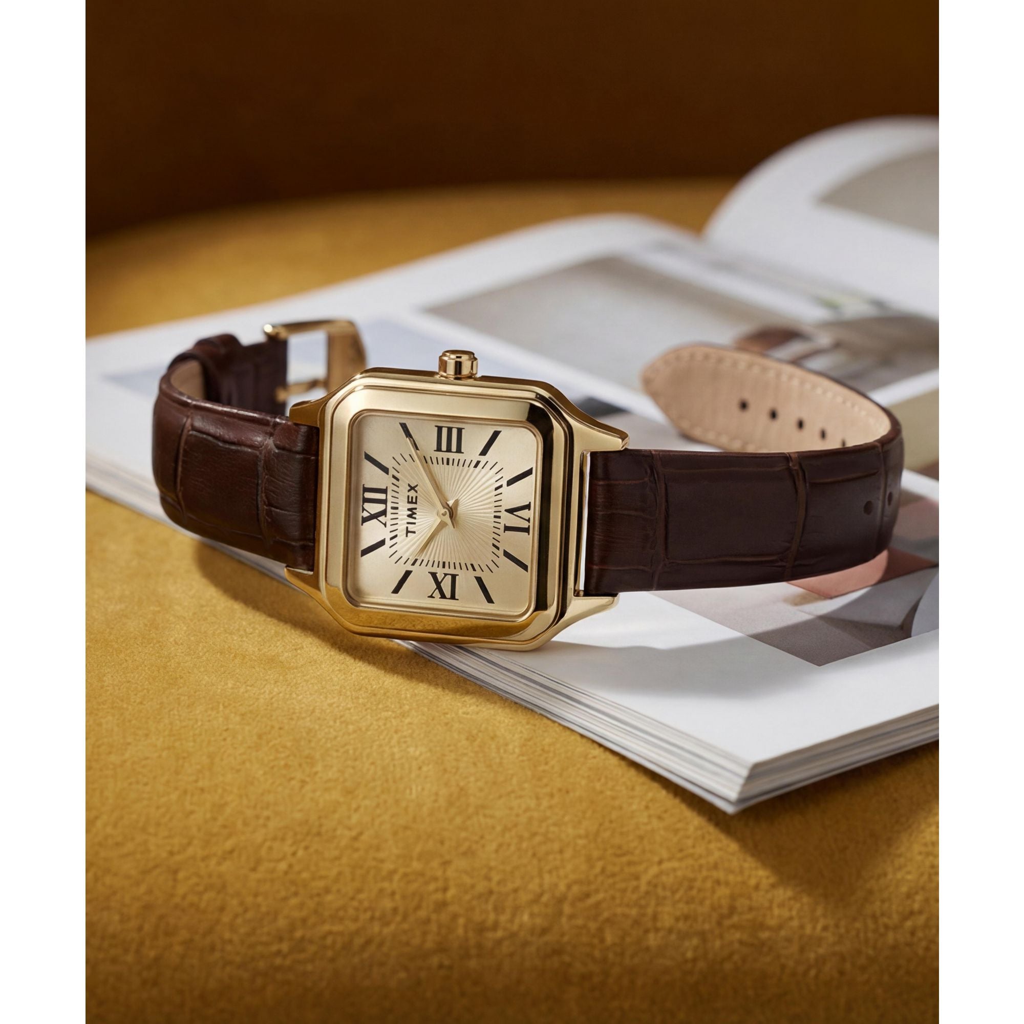 Timex Addison TW2Y90700 champagne dial with Roman numerals on a brown leather strap, styled detail