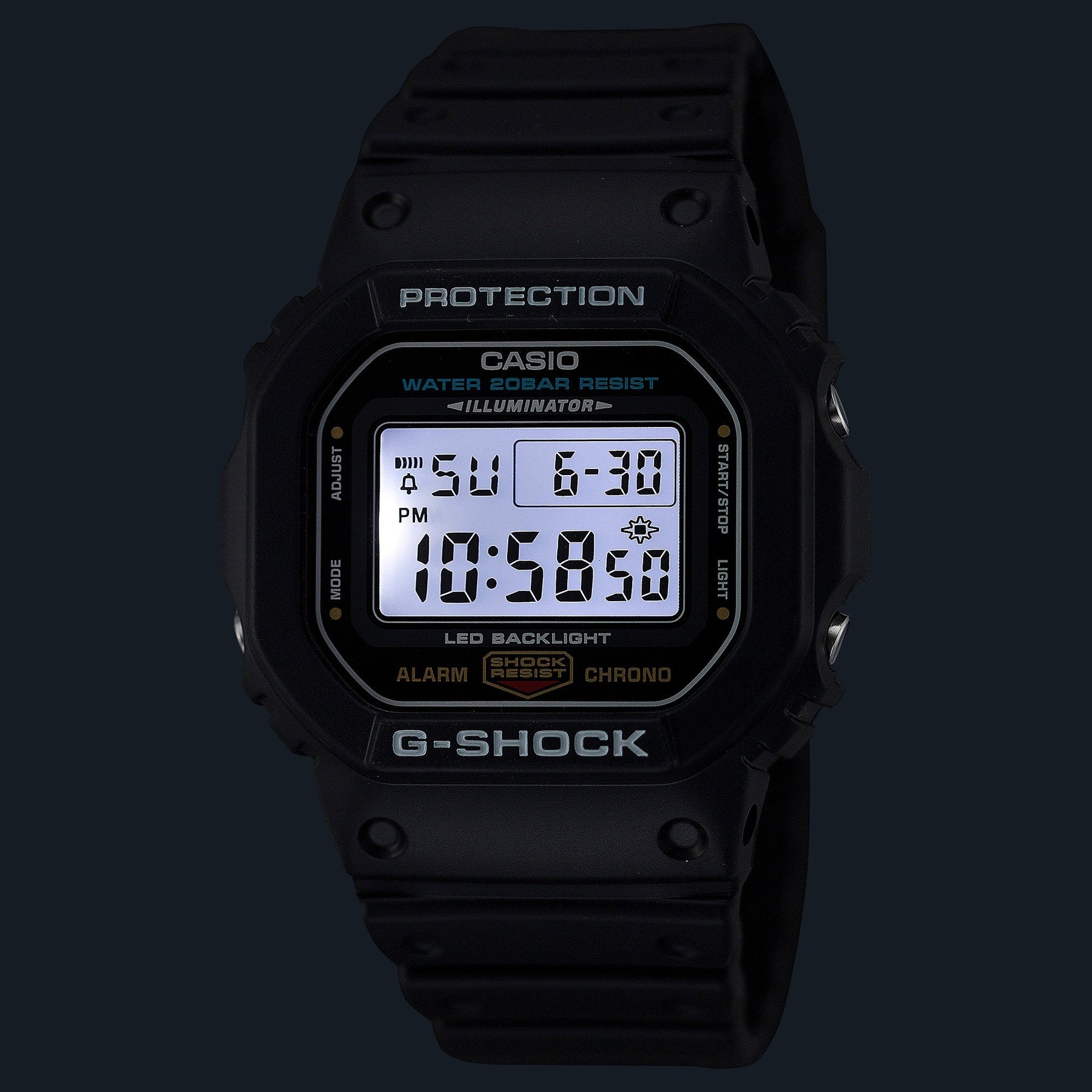 Black Casio G-Shock digital wristwatch with illuminated display showing time and date.
