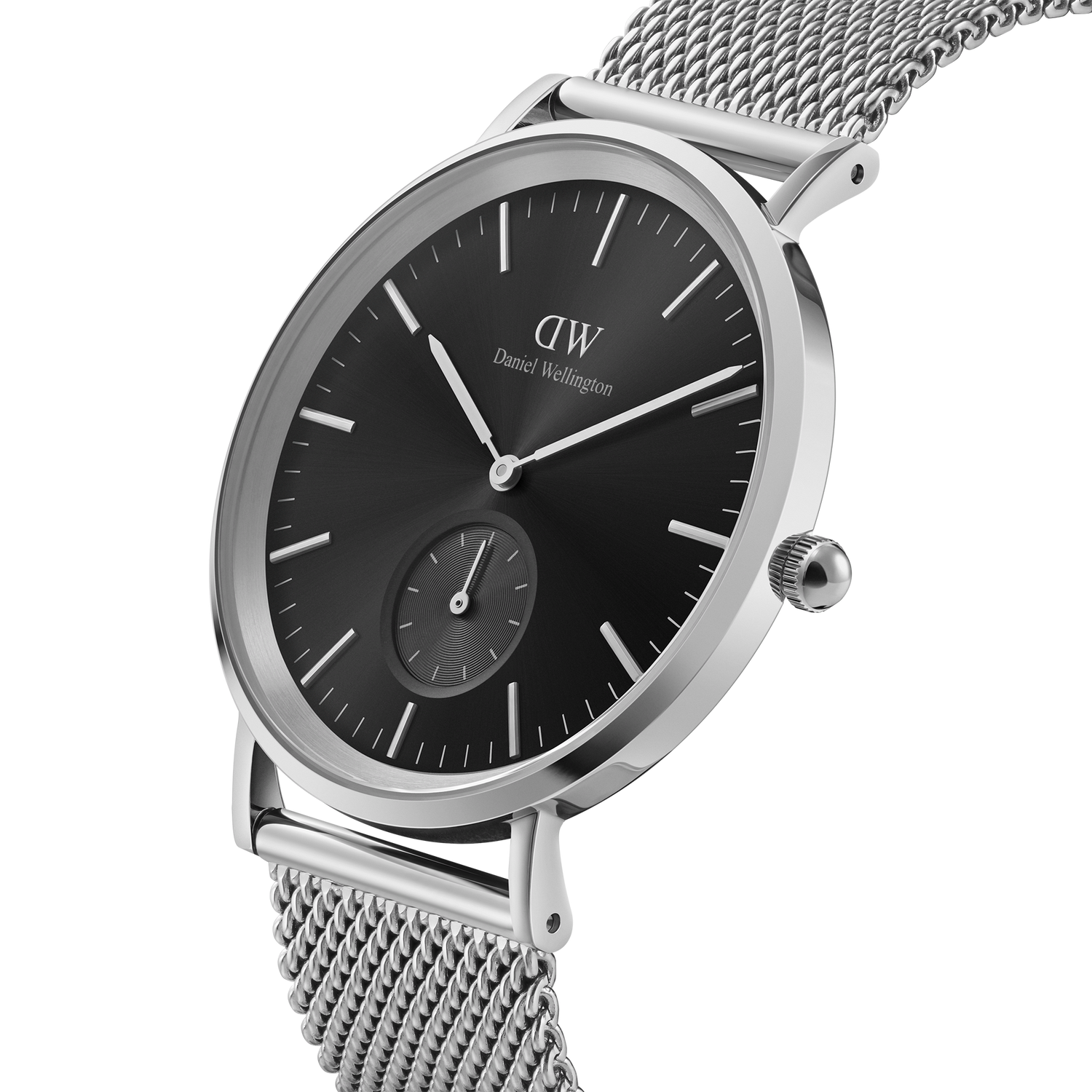 Sleek silver wristwatch with a black dial and mesh metal band.