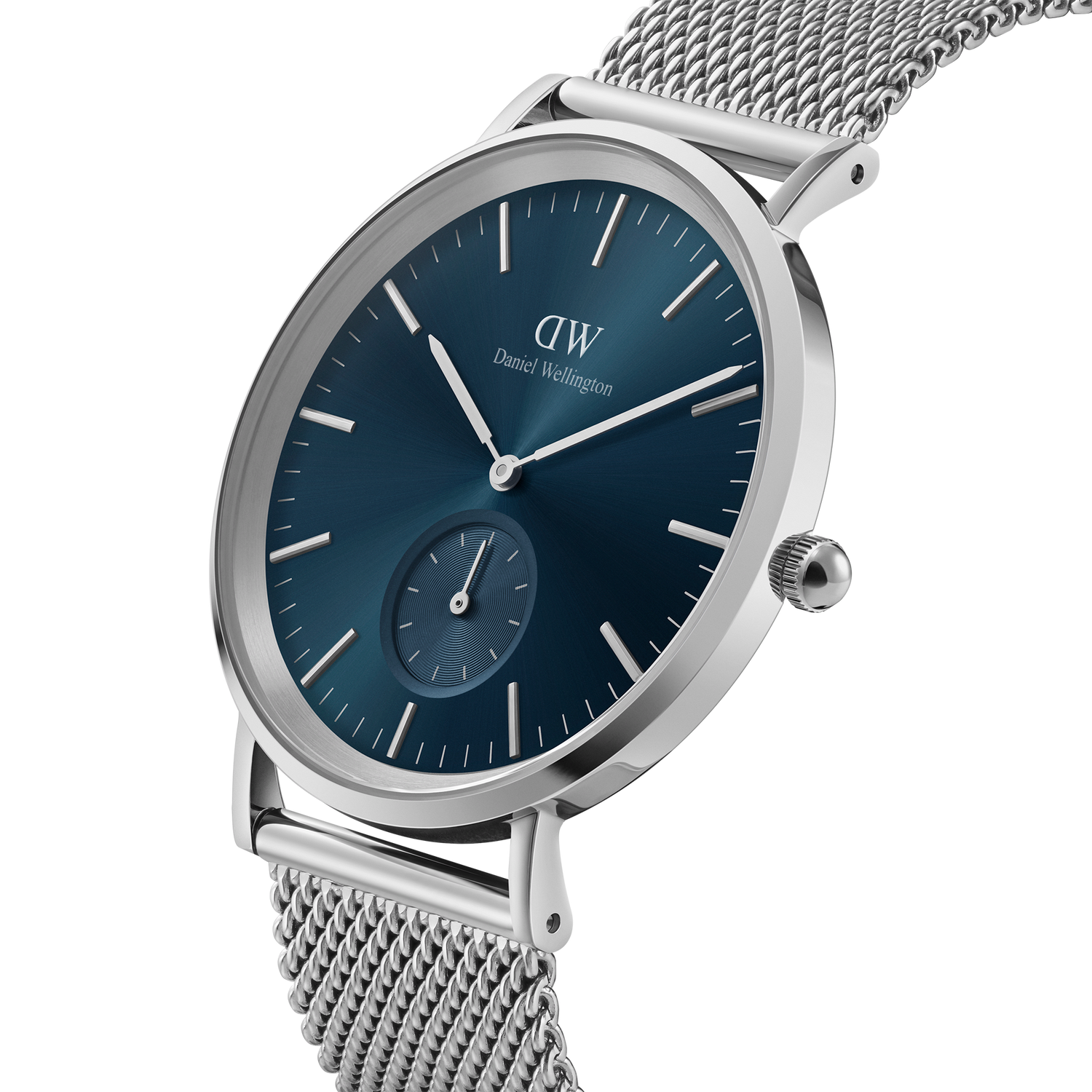 Sleek wristwatch with a blue dial and silver mesh band.