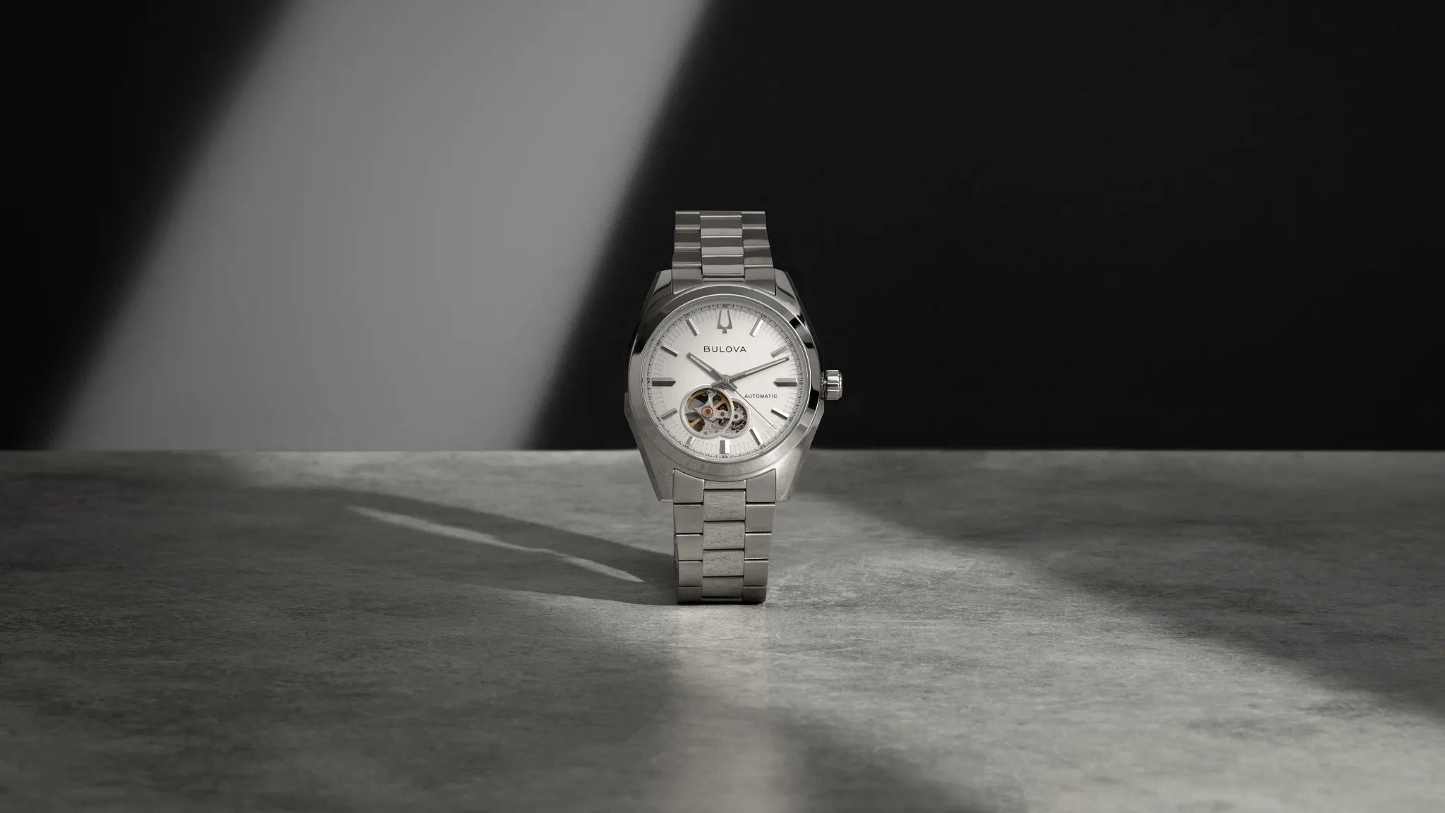 Bulova Surveyor 96A345 automatic men's watch with white dial and silver-tone stainless steel bracelet — lifestyle view