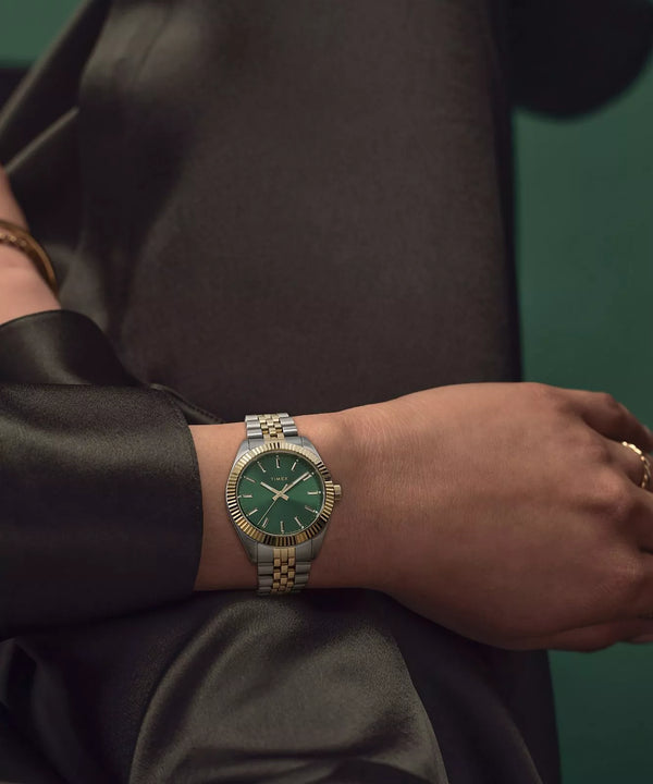 Timex Legacy 36mm Two-tone Case and Bracelet with Green Dial TW2W87400 worn on wrist in elegant setting.
