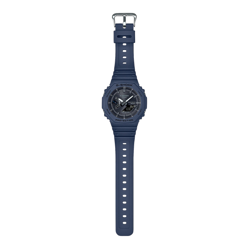 Navy blue digital sports watch with a round face and textured rubber strap.