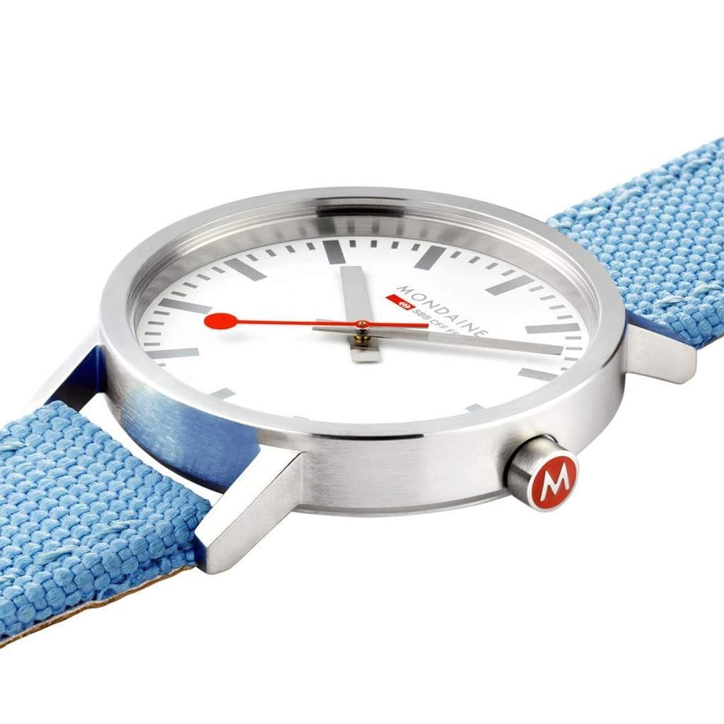 Wristwatch with a white face, red hands, and a light blue fabric strap.