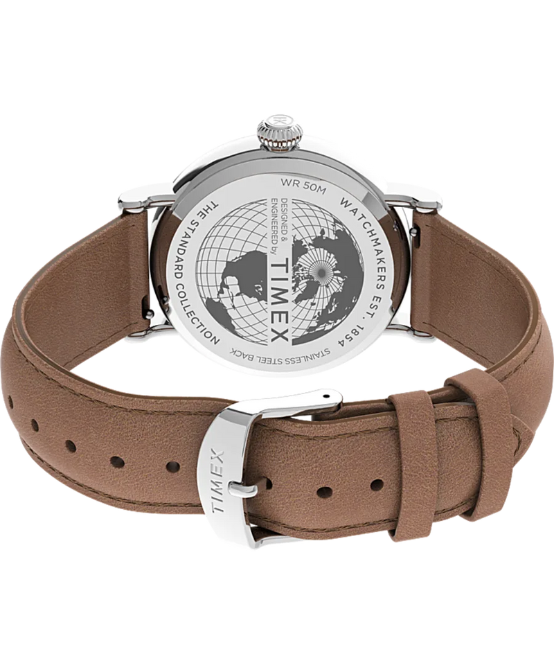 Wristwatch with a brown leather strap and silver-toned case, showing its engraved back.