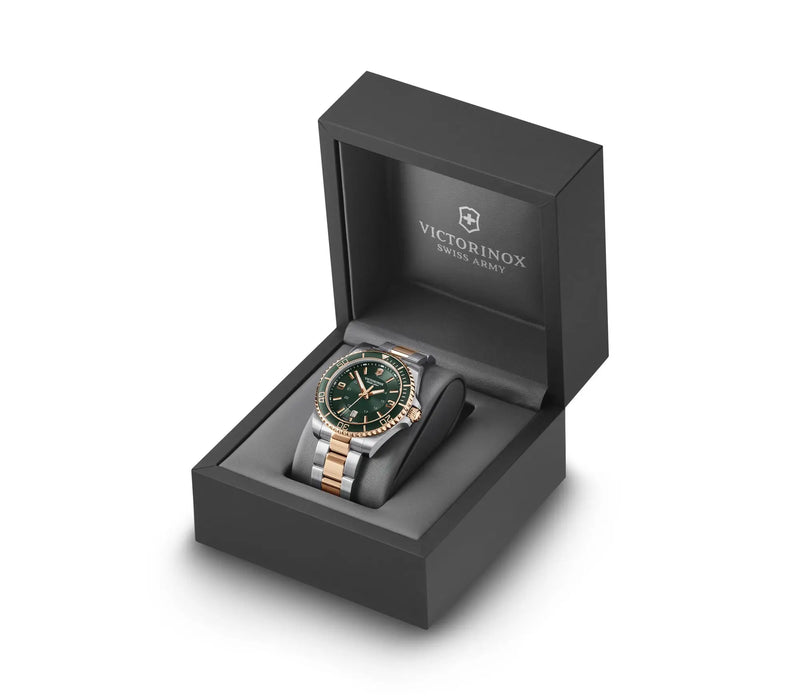 Wristwatch with a green dial in a black presentation box.