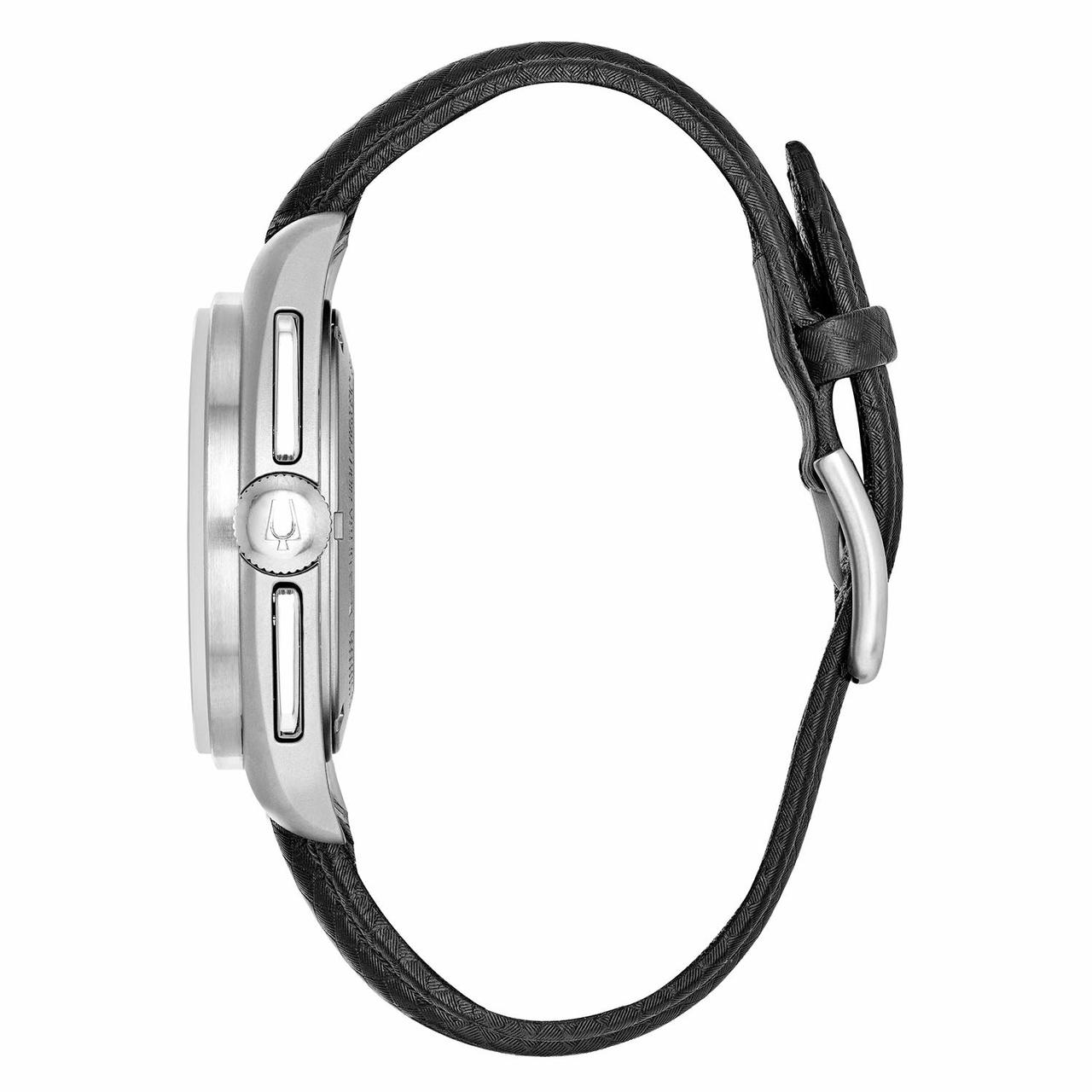 Wristwatch with a silver case and black leather strap.