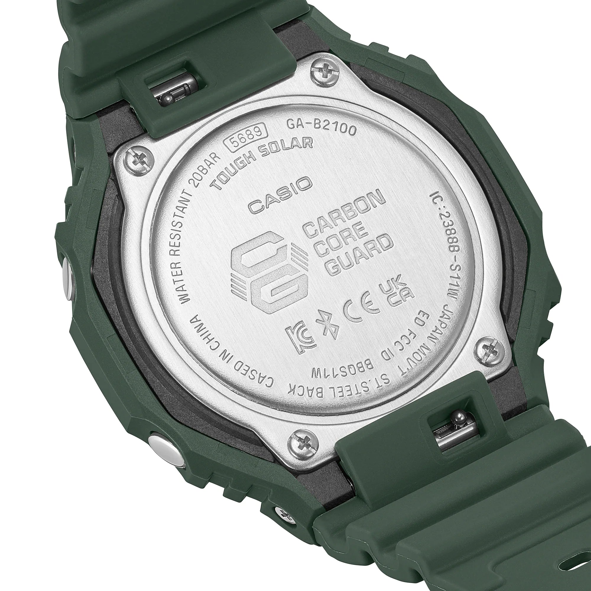 Back of a green Casio G-Shock digital watch with a metal case back displaying product information.