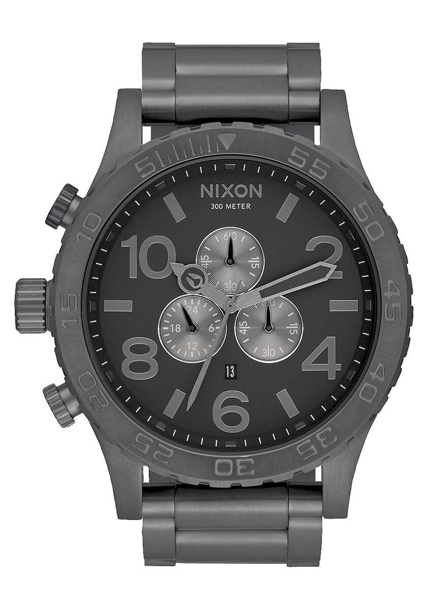 Dark gray Nixon chronograph wristwatch with a metal bracelet.