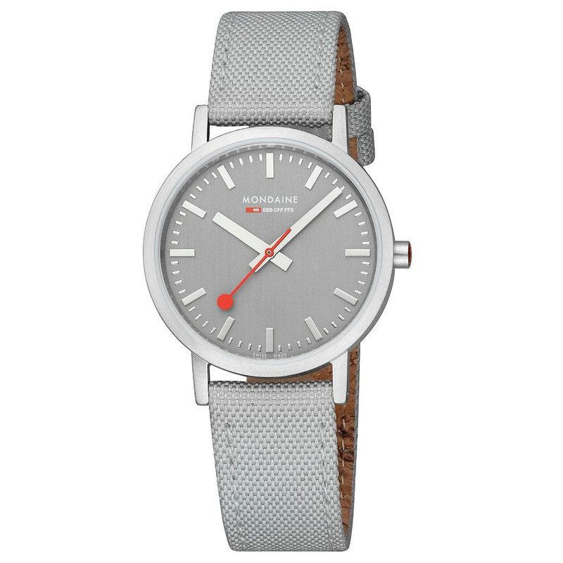 Wristwatch with a gray dial and light gray fabric strap.