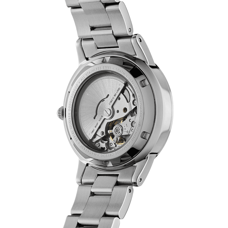 Stainless steel wristwatch with an exposed mechanical movement visible through the transparent case back.