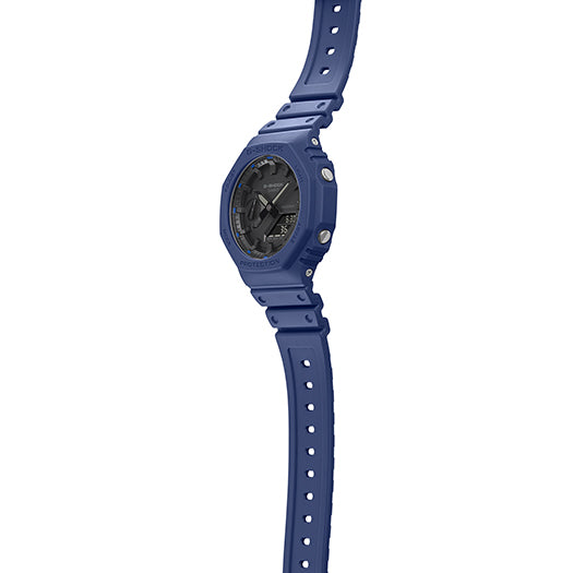 Blue wristwatch with a round face and perforated strap.