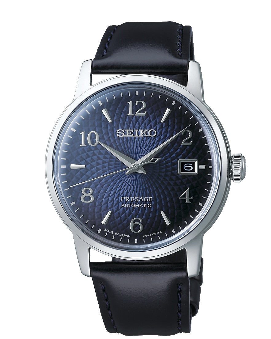 Seiko wristwatch with a blue dial and black leather strap.