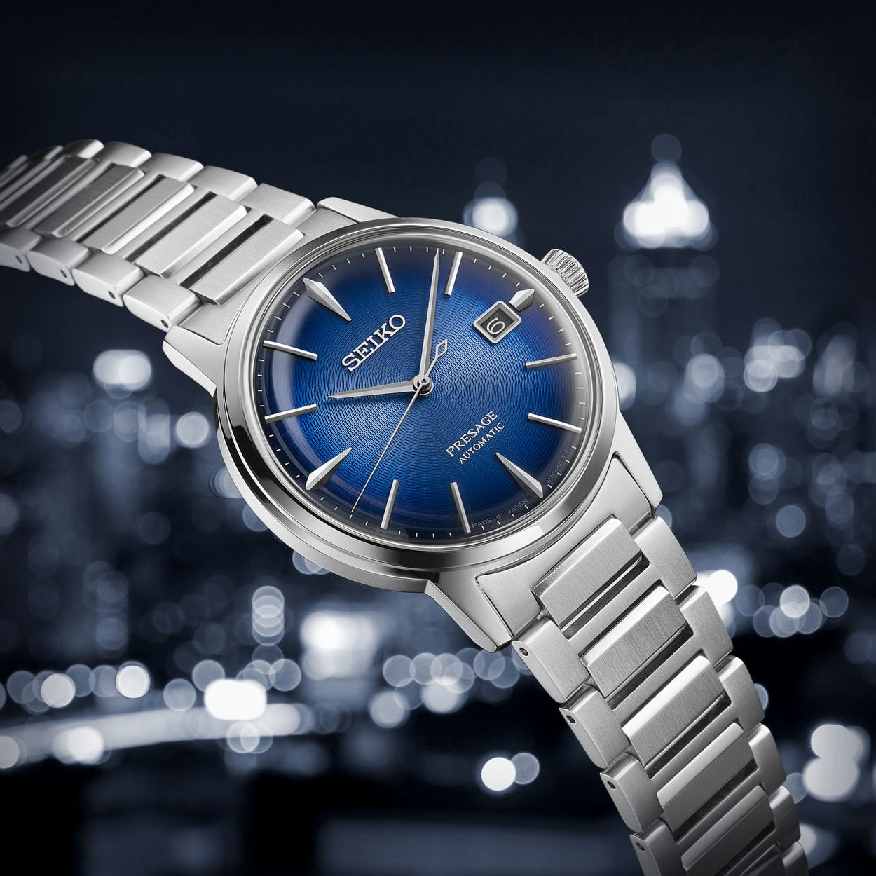 Seiko wristwatch with a blue dial and stainless steel bracelet.