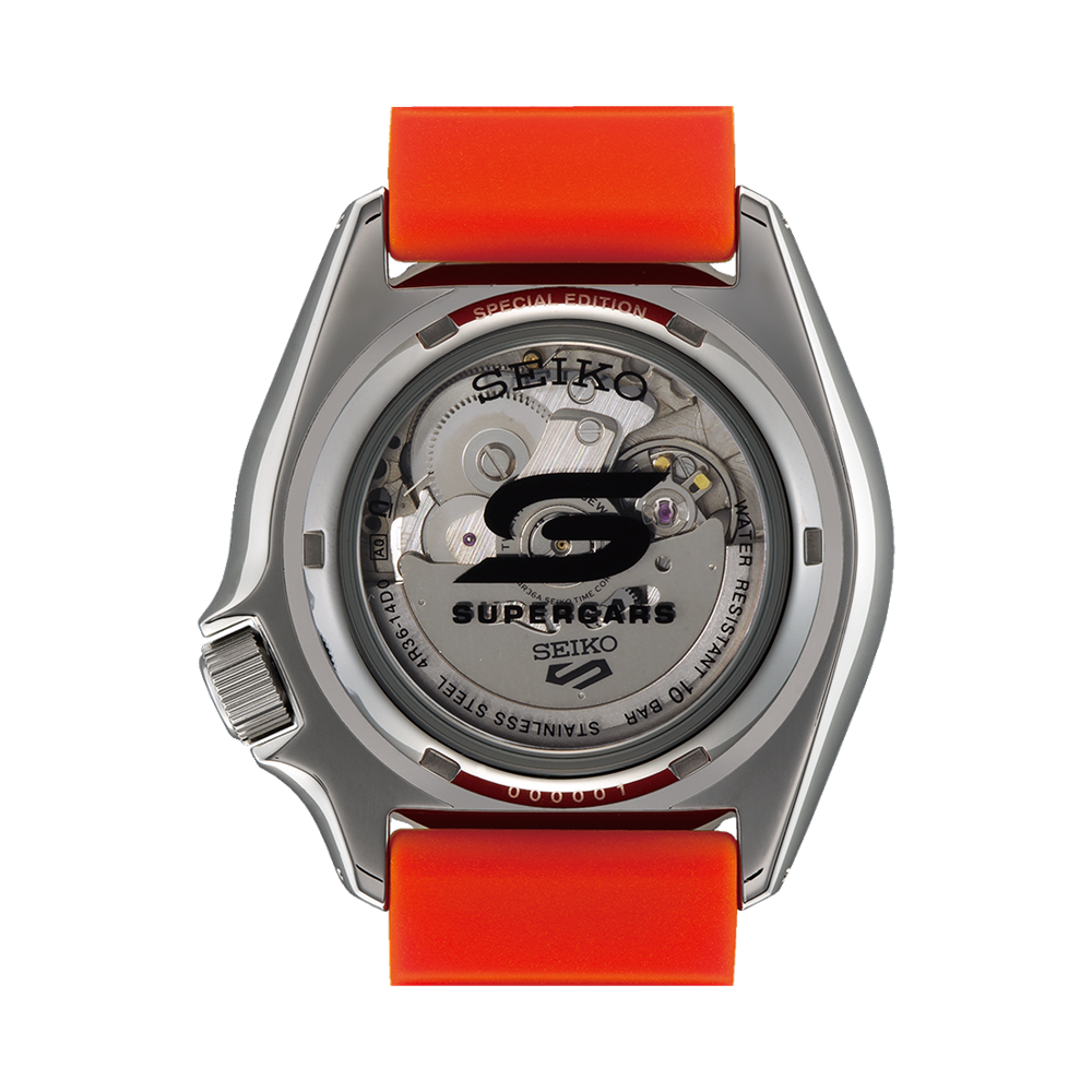 Seiko wristwatch with a transparent case back and bright orange strap.