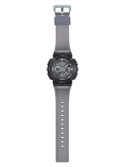 Wristwatch with a black face and gray strap.