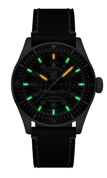 Black wristwatch with glowing green and orange hour markers on the dial.