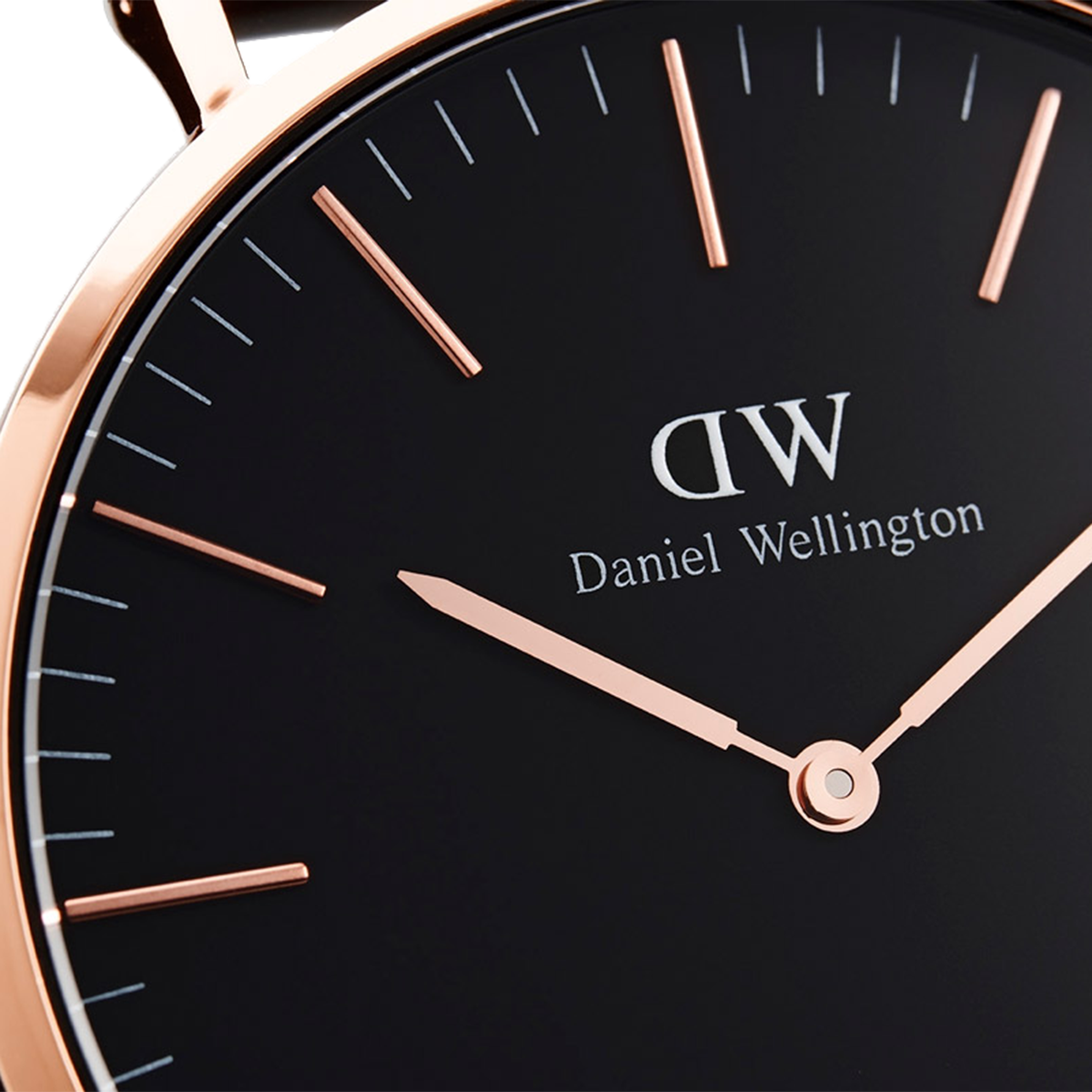 Elegant Daniel Wellington wristwatch with a black face and rose gold accents.