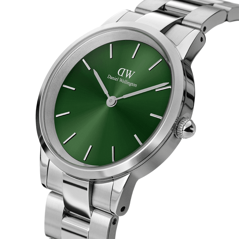 Stainless steel wristwatch with a green dial face.