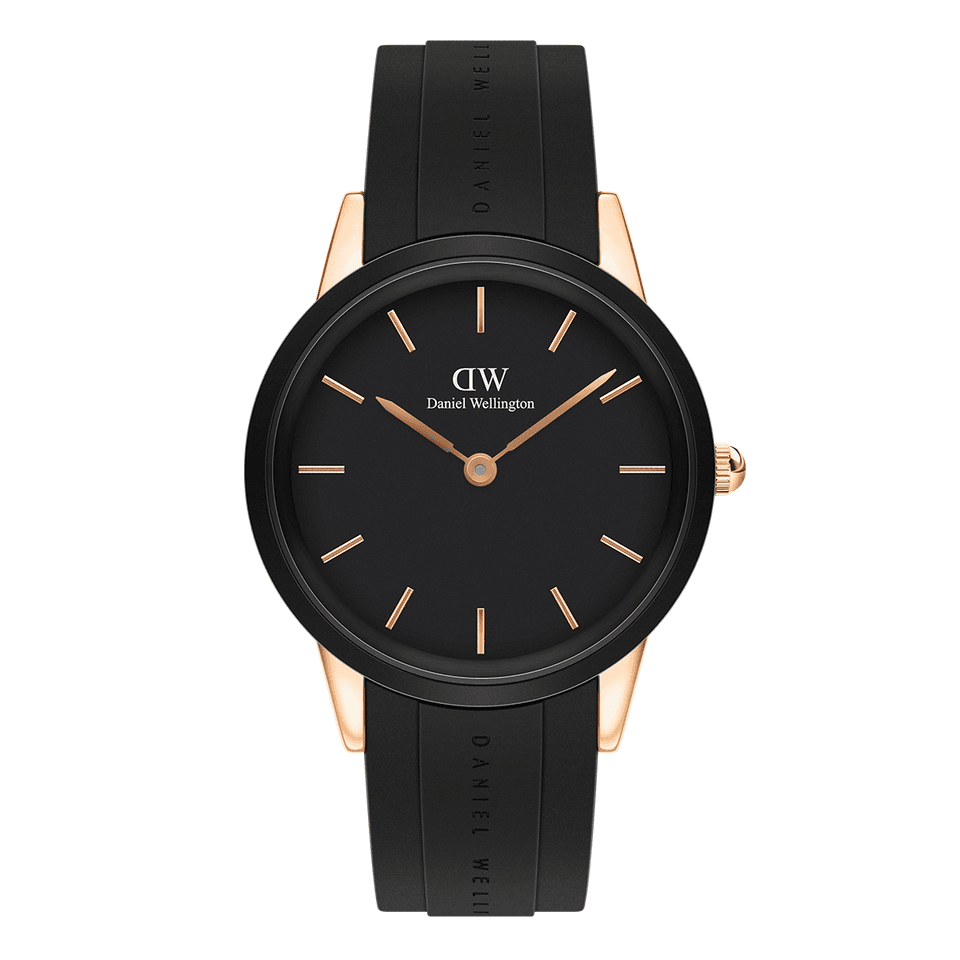 Sleek black wristwatch with rose gold accents and a rubber strap.