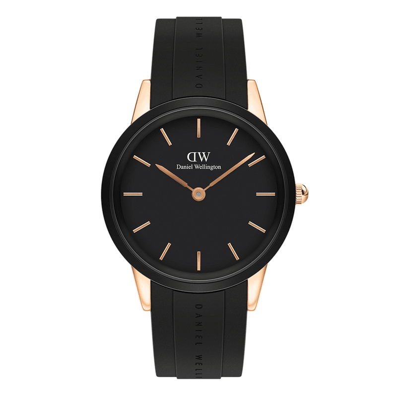 Sleek black wristwatch with rose gold accents and a rubber strap.